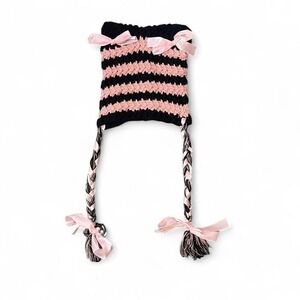 Pink and black knitted beanie with bows and braids